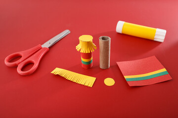 step in creative project, Cylindrical paper rolls form, tubes of paper, step-by-step guide or templates, Festive paper craft toy soldiers, DIY blogs, craft stores, and seasonal product packaging