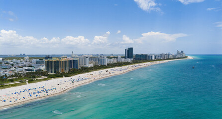 Miami beach with turquoise waters. Aerial view of sandy coastline and waves. Tropical Miami Beach...