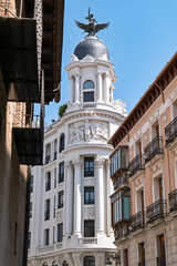 Valladolid, Spain &ndash; View of an old building along a historic street on a sunny day with high contrast.