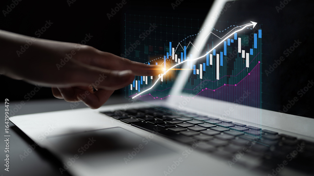Aufkleber a close-up view of a hand interacting with a laptop screen displaying a digital financial graph. the