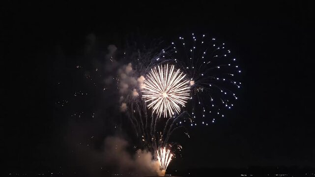 Spectacular fireworks display illuminating the night sky with vibrant bursts of color during festive celebration event video