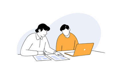 Two people collaborate, reviewing documents.
