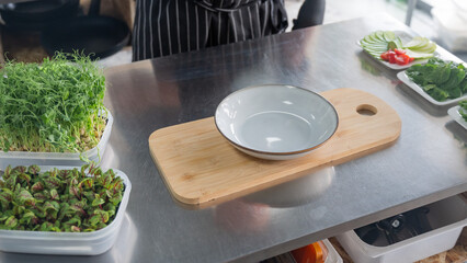The chef lays out the salad. 