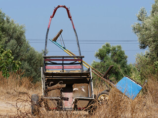 parked or no longer used donkey carts or horse trailers, often still used for agriculture