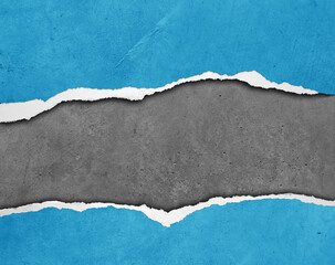 Ripped blue paper on grey background