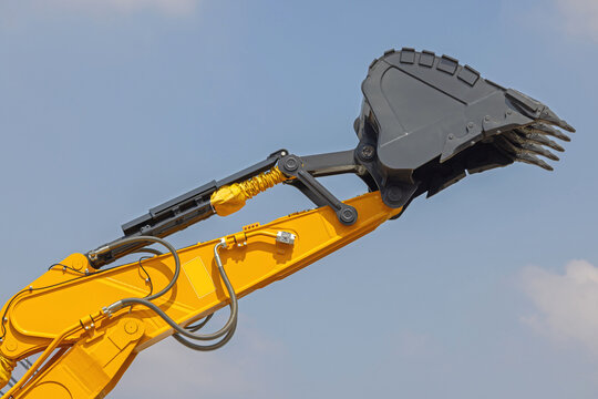 Excavator Digging Bucket High Possition Over Blue Sky