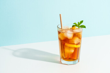 Summer cold drink on colored background with hard shadows.