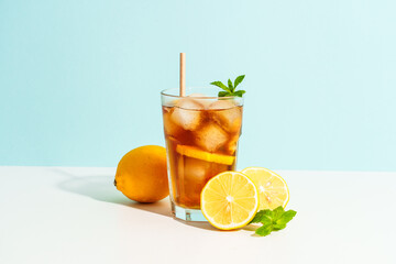 Fototapeta premium Summer cold drink on colored background with hard shadows.