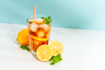 Summer cold drink on colored background with hard shadows.
