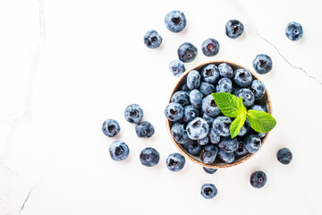 Blueberries in the bowl on white.