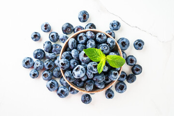 Blueberries in the bowl on white.