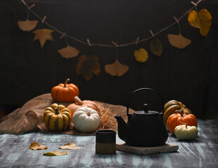 Autumn Pumpkins with black cast iron tea pot and cup