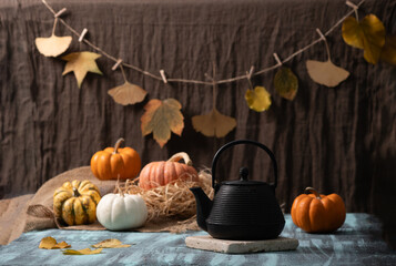 Autumn Pumpkins with black cast iron tea pot and cup