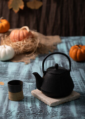 Autumn Pumpkins with black cast iron tea pot and cup