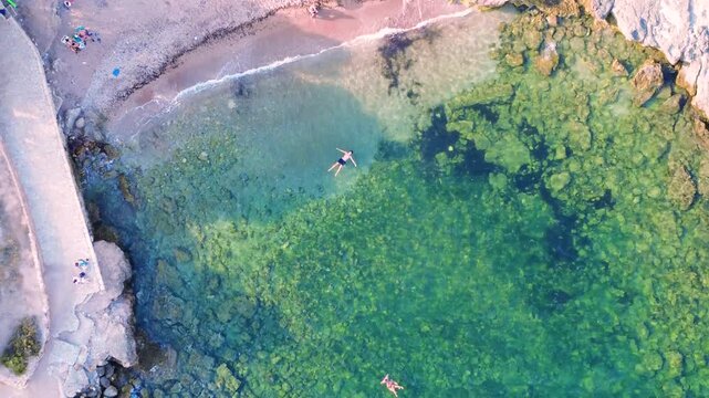 Floating man on the beach