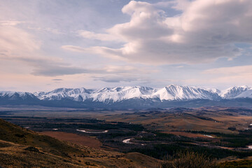 Panoramic Beautiful autumn landscape of snowy mountains and vast valley in Altai Siberia Russia