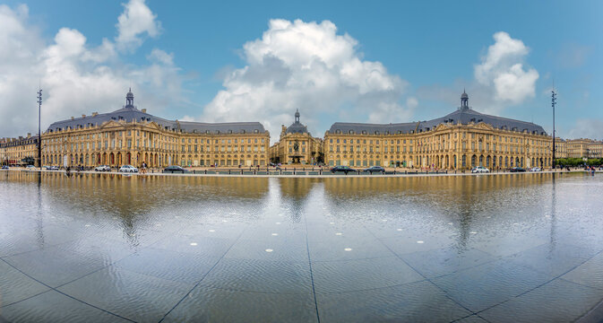 Panoramic view of the water front of Bordeau with the magnificent Place de la Bourse Square reflected on the waters of the Mirroir d'eau, Gironde, Nouvelle-Aquitaine, France
