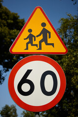 Children crossing warning sign with 60 km speed limit