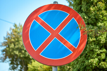 No stopping road sign on a sunny rural roadside