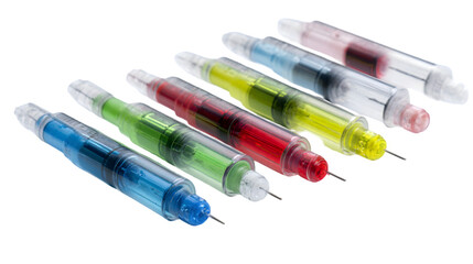 Close up of colorful syringes with needles arranged in a row on a white surface with black background
