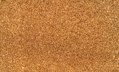 Photo of the texture of the cork substrate.A wall made of cork wood for pinning information on needles.