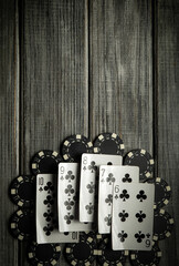 A display of playing cards showing a winning hand straight flush , surrounded by black and white...