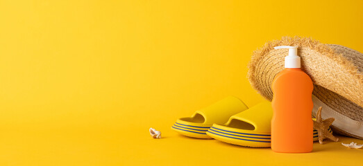 A bright and cheerful arrangement of summer essentials including a hat, slippers, and lotion on...