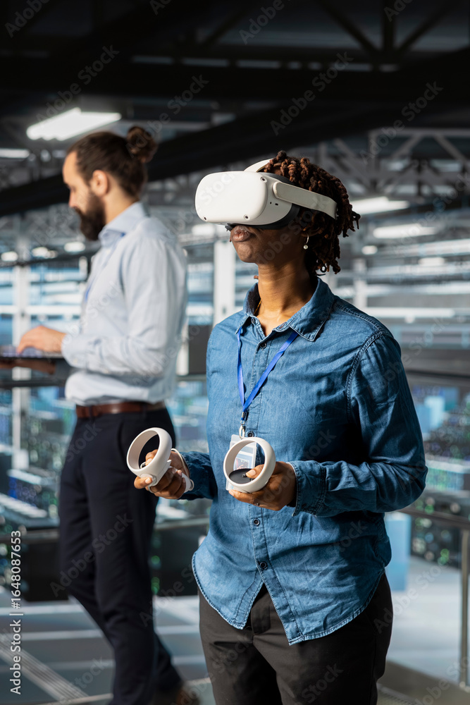 Poster woman engineer analyzing performance outputs using virtual reality tech on data center industrial pl