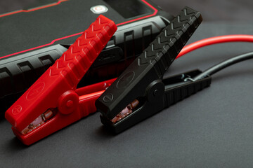 Crossed jumper clips for starting next to the power supply. Heavy duty battery clamps for...
