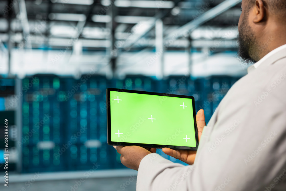 Poster close up of admin in data center using green screen tablet to managing infrastructure systems. serve