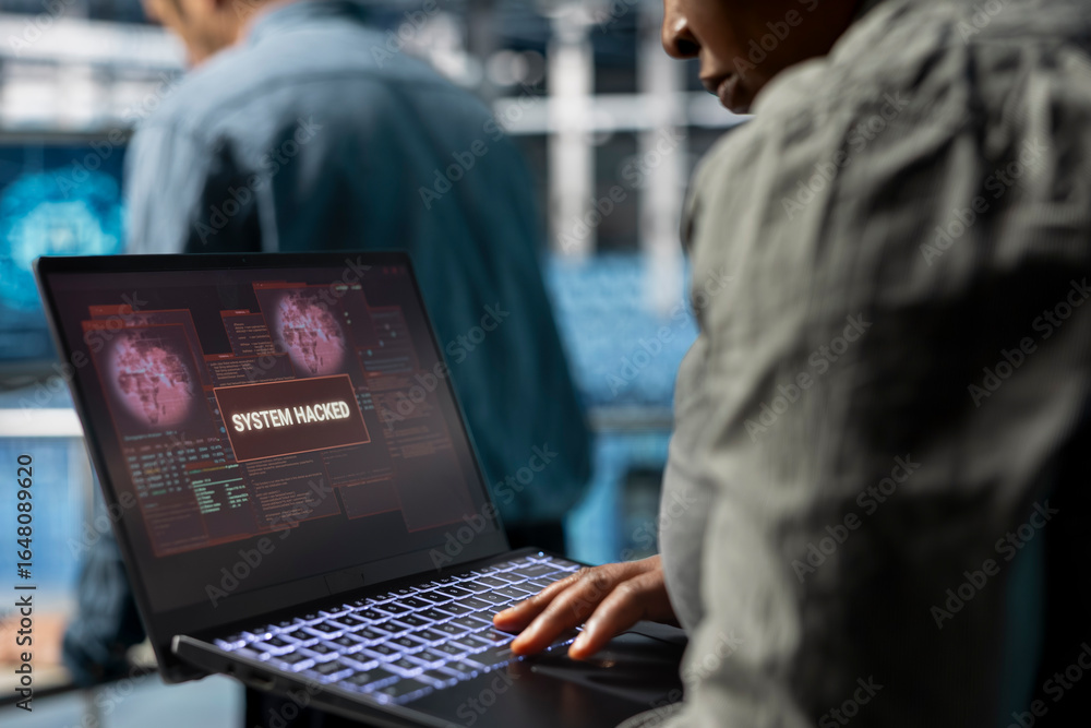 Poster close up of data center technician trying to minimize damage of hacker stealing sensitive company da