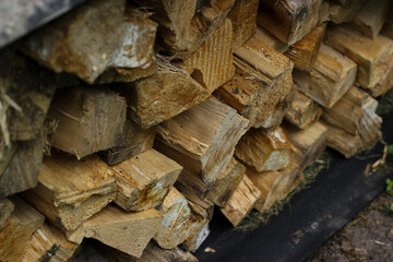 Chopped firewood. Chopped firewood is stacked in a pile. Firewood pile. Firewood stacked and...