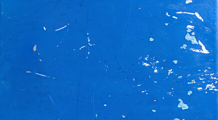 Close-up of aged plastic surface with worn texture and faded color