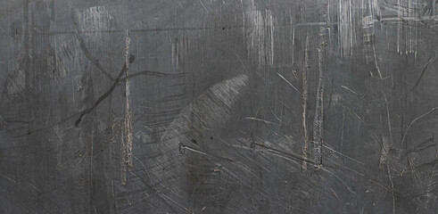 Scratched plastic surface with rough texture, seen up close