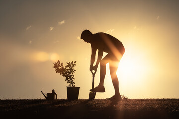 Man planting a tree, Caring for Mother Earth, nature, environment and ecology