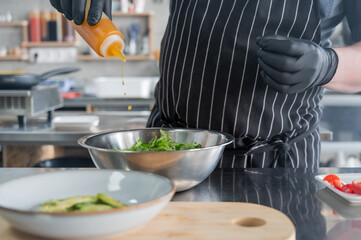 The chef prepares a salad. 