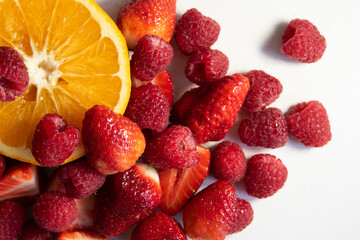 fresh raspberries strawberries and orange slices