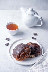 Poppy seeds filling buns with chocolate topping in a plate