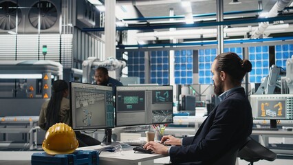 Professional inspector reviewing manufacturing process data on computer, ensuring seamless solar...