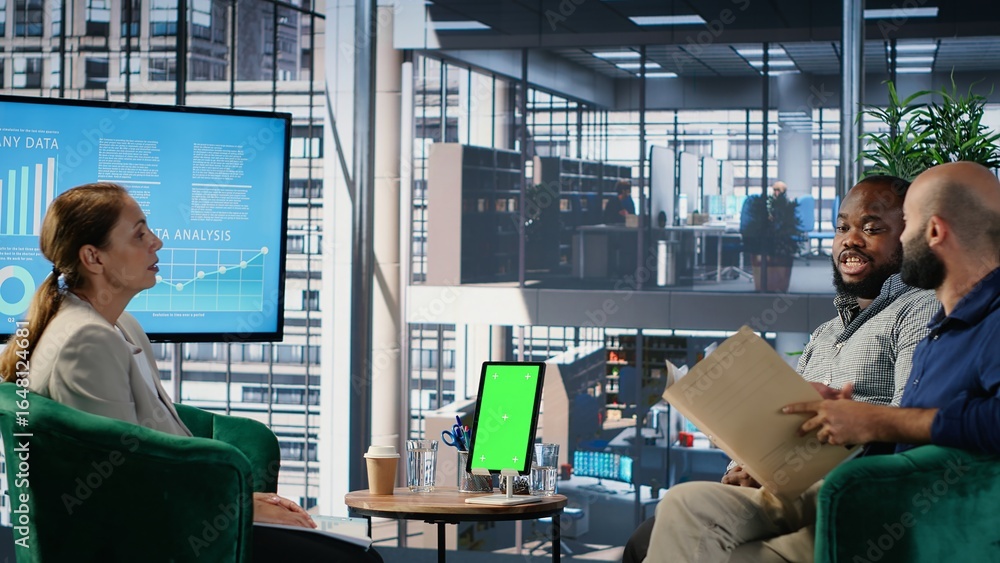 Poster diverse management group does strategic thinking next to chroma key, analyzing data to guide company