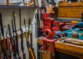 Gunsmithing tools on a working table at a gun shop