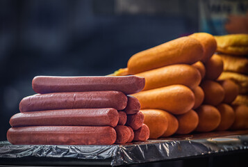A large display of delicious hot dogs and corn dogs at a street stand, New York