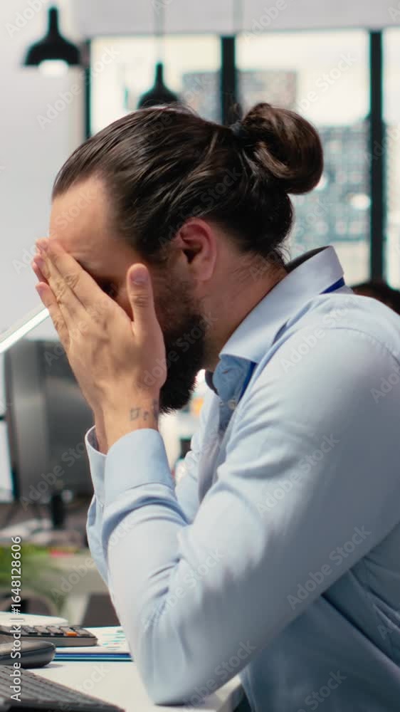 Poster vertical video trader covering face in disbelief, concerned by investment portfolio value drop after