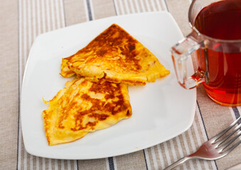 Appetizing pancakes with a filling of minced liver and eggs