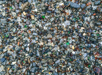 View of weathered sea glass on beach in fort bragg 