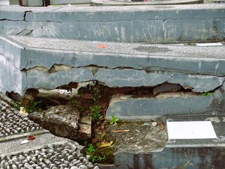 Damaged public facilities include cement seating for resting that is not maintained, with the...