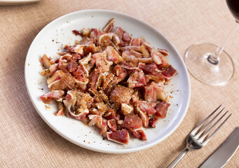 Image of pig ears/orejas, beautiful restaurant presentation of dish