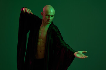 Black and white image of a man performing graceful dance moves, showcasing strength and emotion...