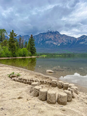 Pyramid Lake sandy beach with Pyramid mountain in background, Jasper NP, Canada