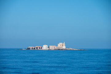 Boat trip from Trapani with view of fort, blue water and fisherman's boats, travel destination on...